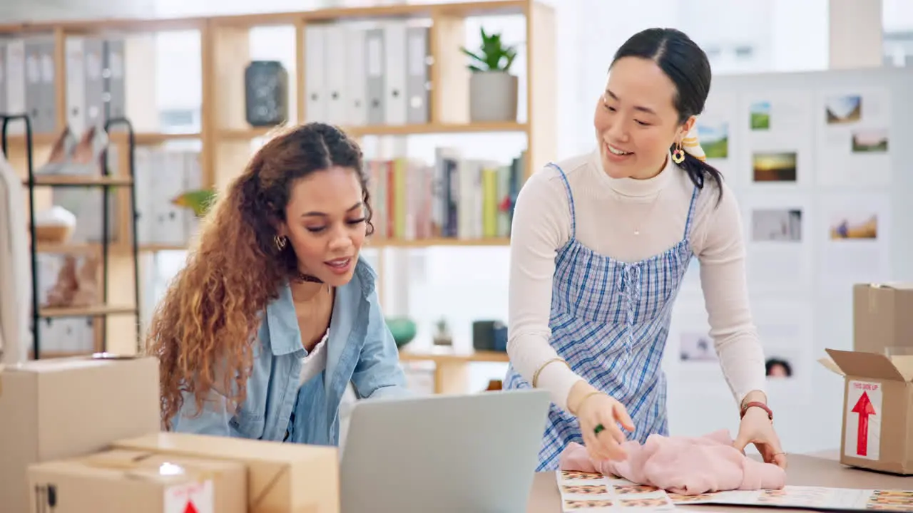 Small business laptop and a team packing an order