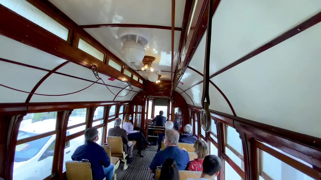 People go inside an old tram