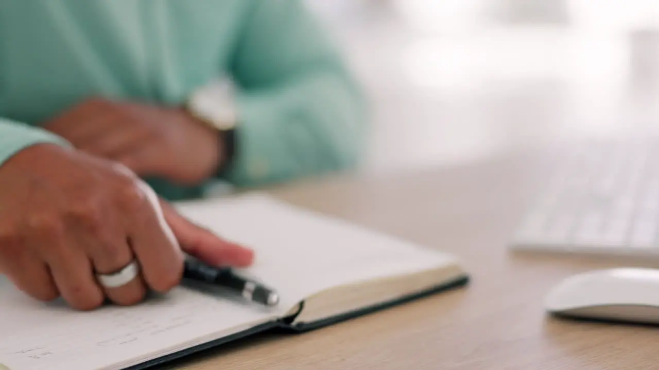 Closeup hands and notebook for planning