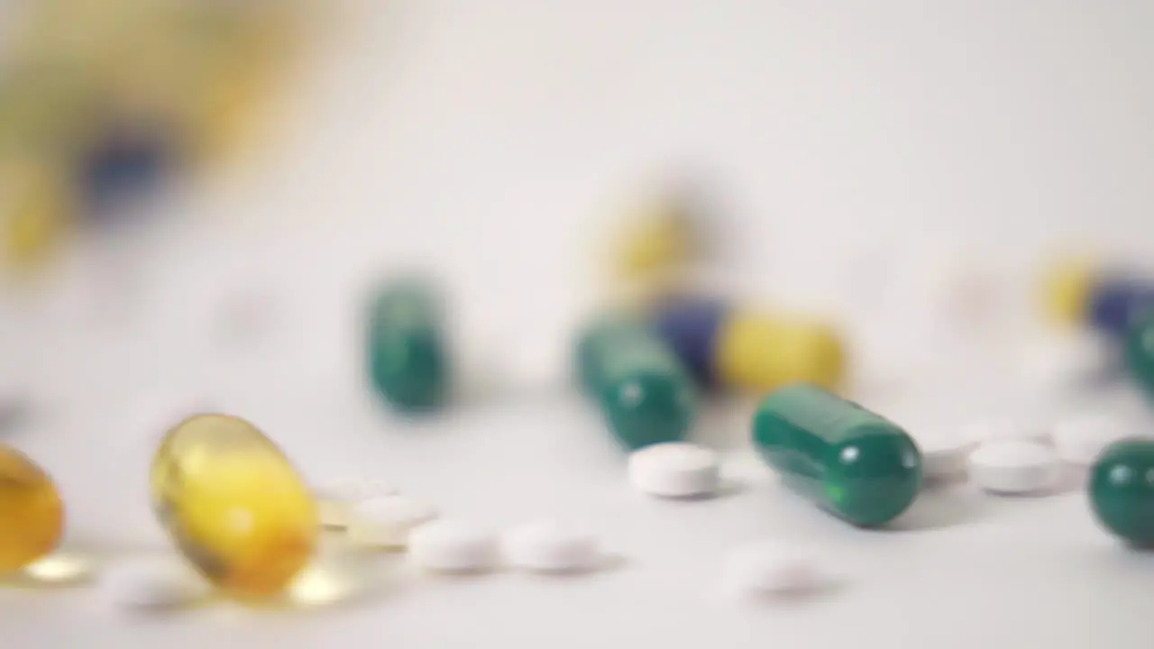 Macro Slide of Pill Varieties Strewn on White Background