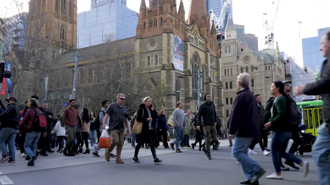 melbourne daytime traffic footages commuters walking intersection in Melbourne CBD melbourne public transport melbourne tram melbourne train melbourne bus