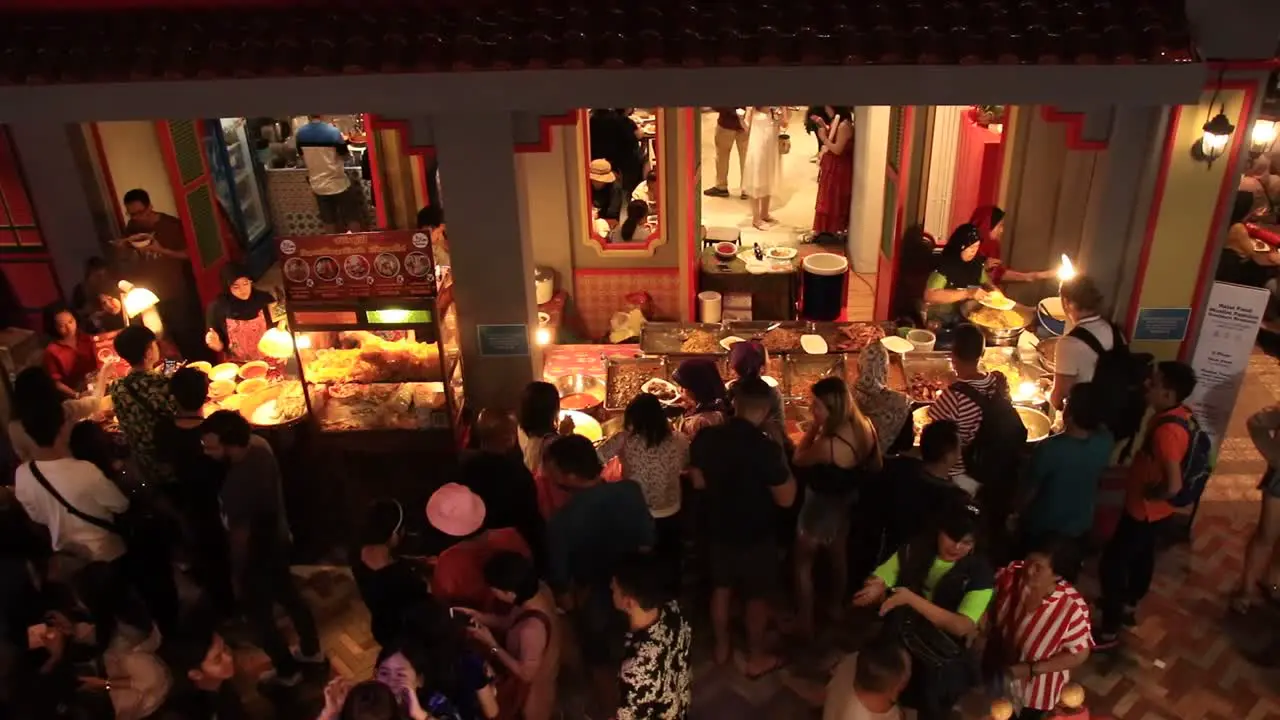 Crowd of people buying traditional Malaysian dish at the food court of Icon Siam Mall