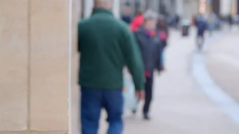 Sliding Shot Revealing Defocused City Pedestrians