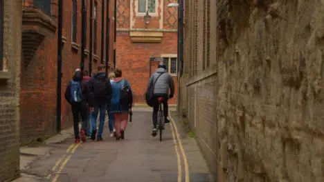 Tracking Shot Following Pedestrians and Cyclists In Quiet Backstreet