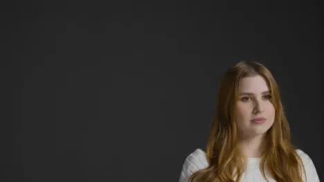 Mid Shot of Young Woman Looking Away from Camera