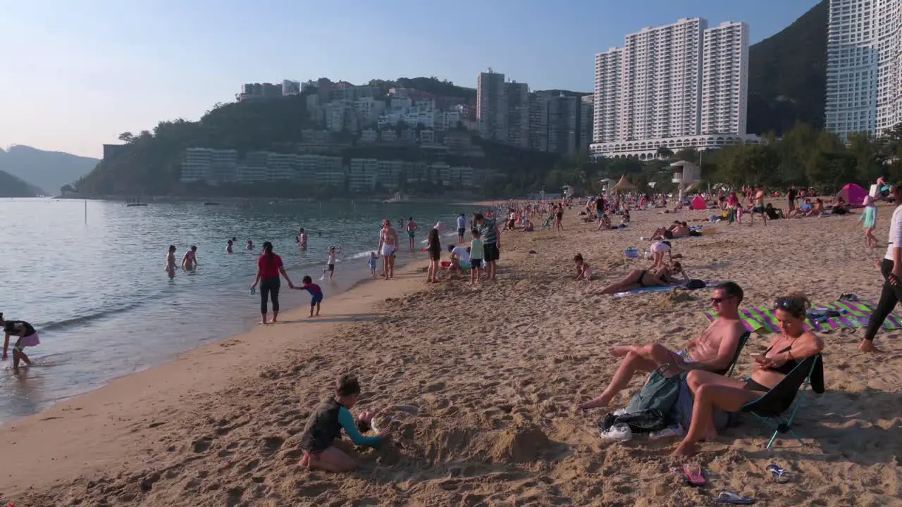 People enjoying the evening at Repulse Bay beach in Hong Kong as public beaches reopening after months of closure amid coronavirus outbreak to the public