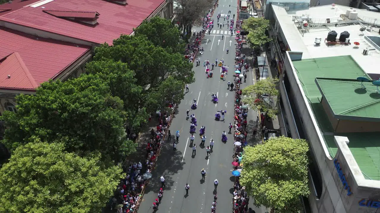 Costa Rican Independence Day Parade High Drone Shot Over Marching Bands and Children Dancing in Traditional Clothing