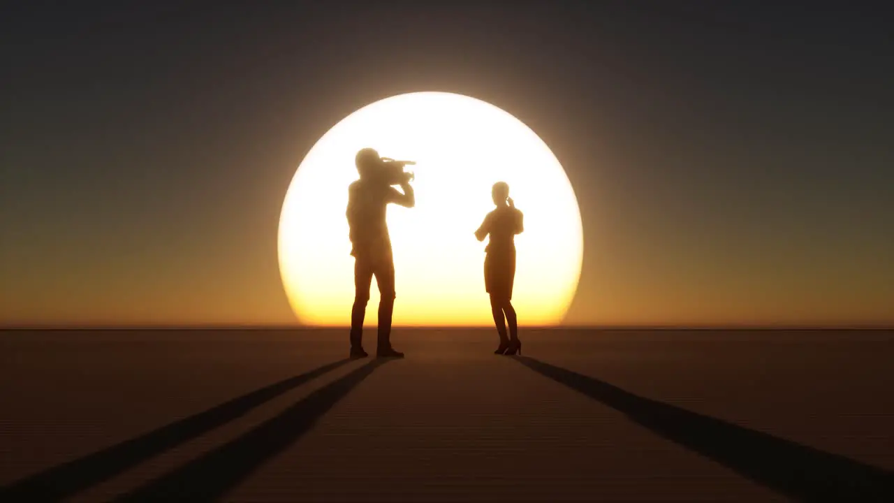 Cameraman and reporter silhouettes on large sunset standing