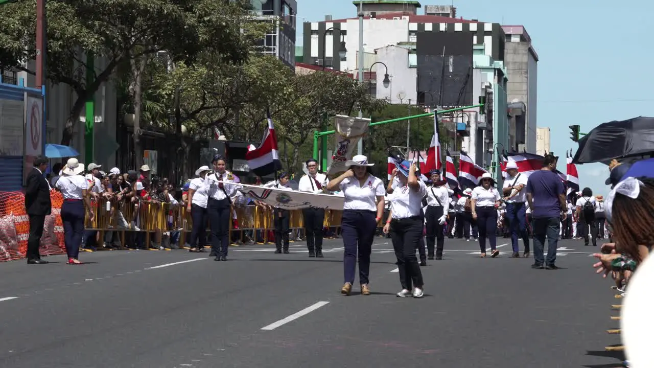 Teachers and Students Marching Down Avenue During Costa Rican Independence Day Parade