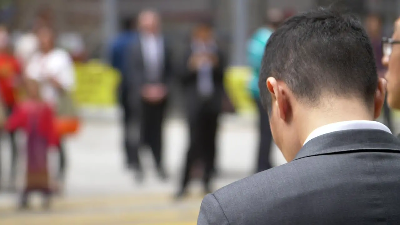 Businessman on Busy Street