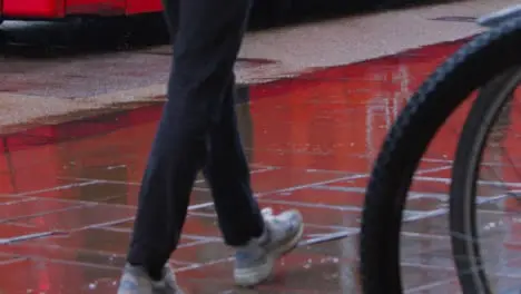 Medium Shot of Pedestrians Feet Walking In Rain