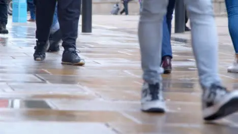 Long Shot of Pavement as Pedestrians Walk Along It 