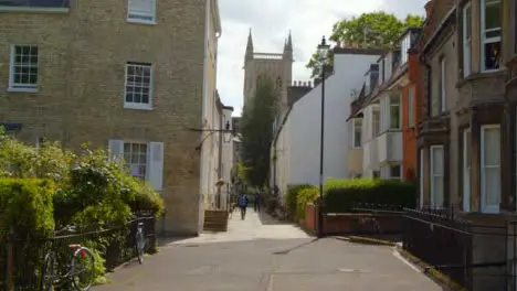 Tracking Shot Following Pedestrian Up Quaint English Street