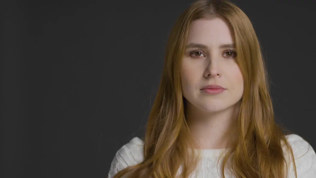 Mid Shot of Young Woman with Neutral Expression with Copy Space