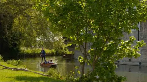 Tracking Shot Approaching Gondola On River Cam