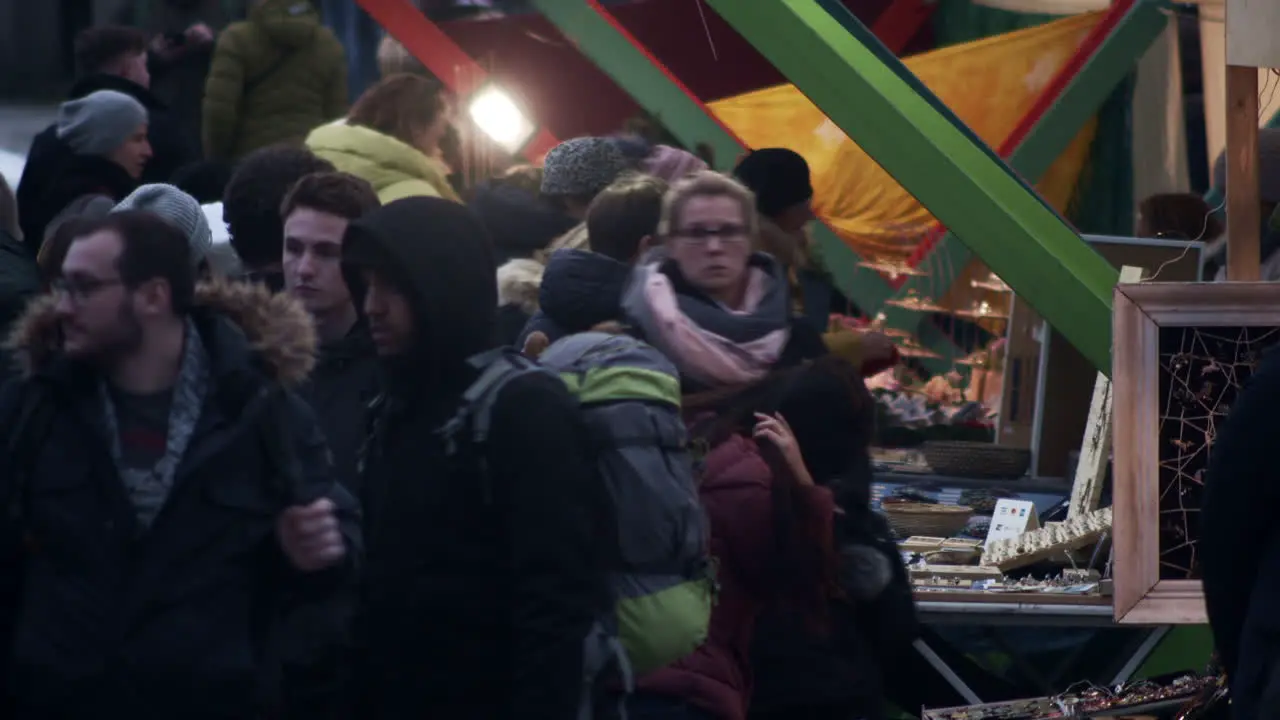 Crowd browses vendors at Christmas market in Prague