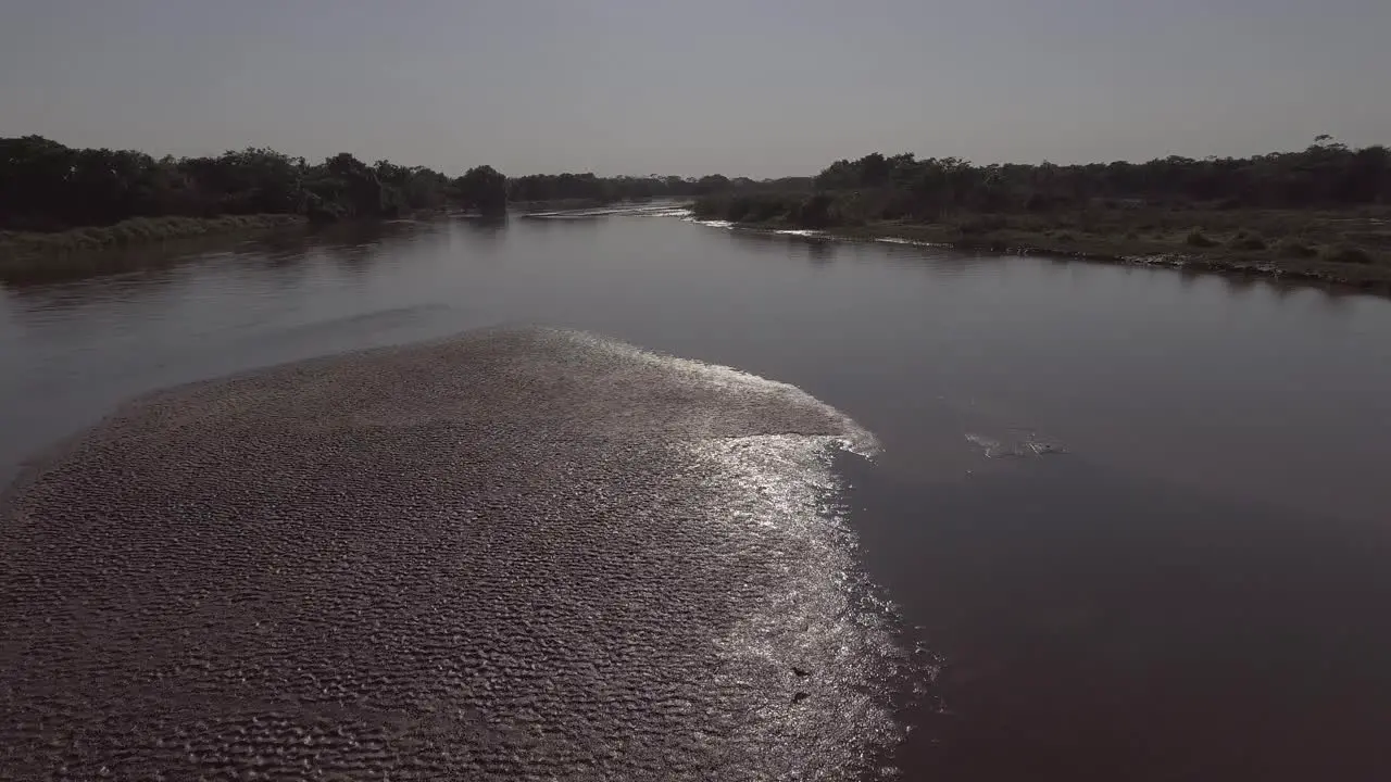 A river full of mud because sediment deposit after gully erosions