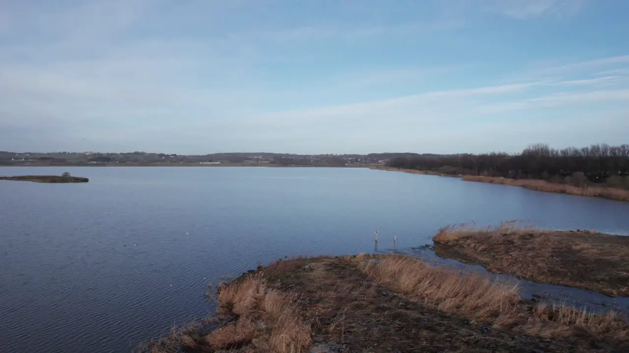 Magnificent Birdseye Footage of a Lake and River in Denmark Dolly Out Shot