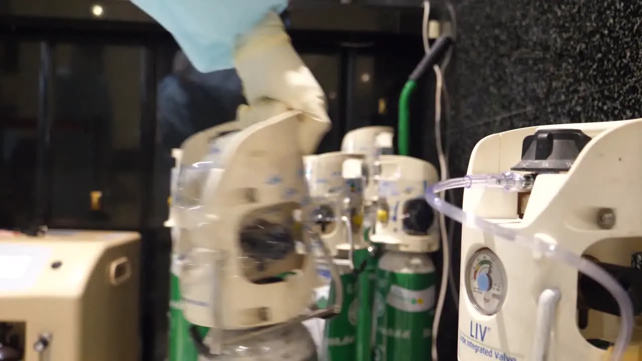 Medical Staff Wear Glove While Pick Up Medical Oxygen Tank Close Up