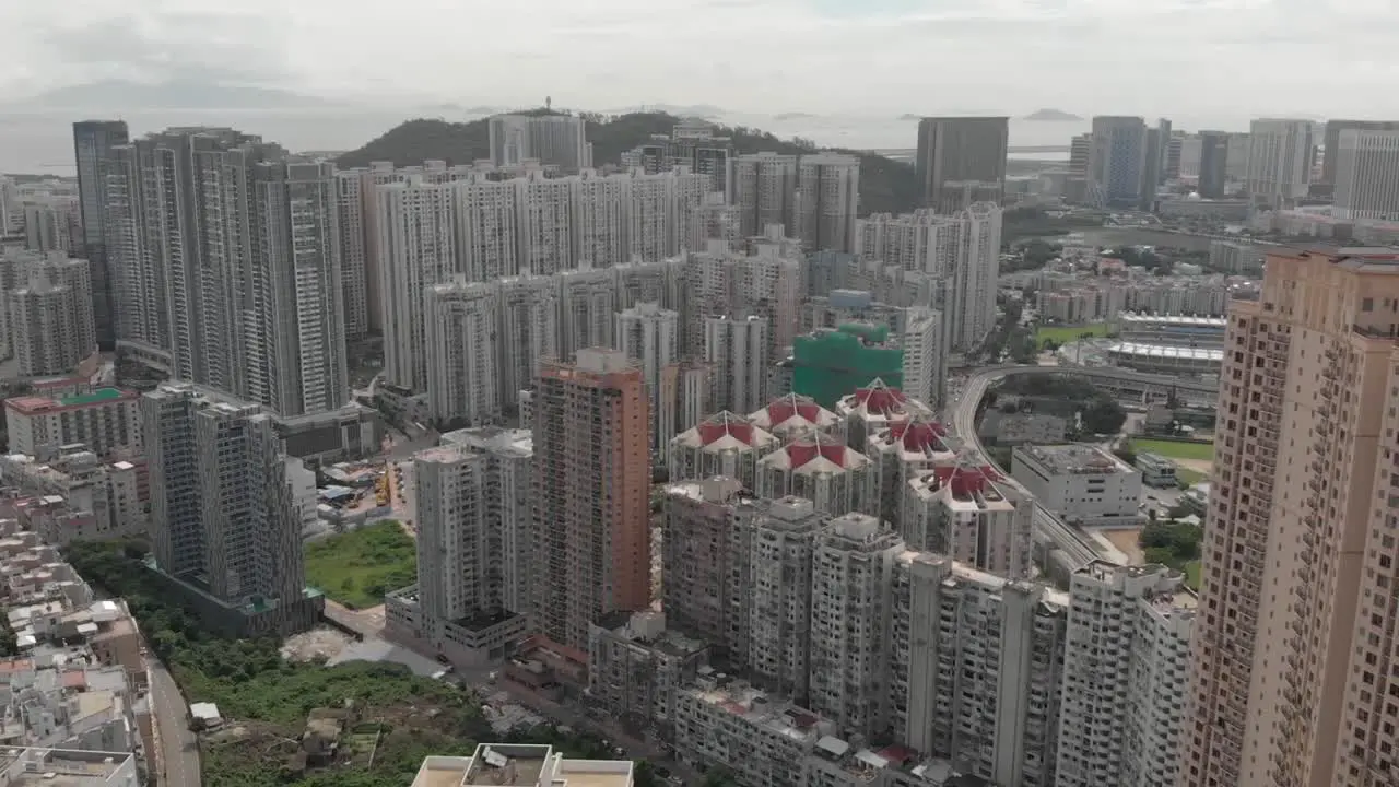 Aerial drone shot of Taipa highrise apartment buildings on cloudy day