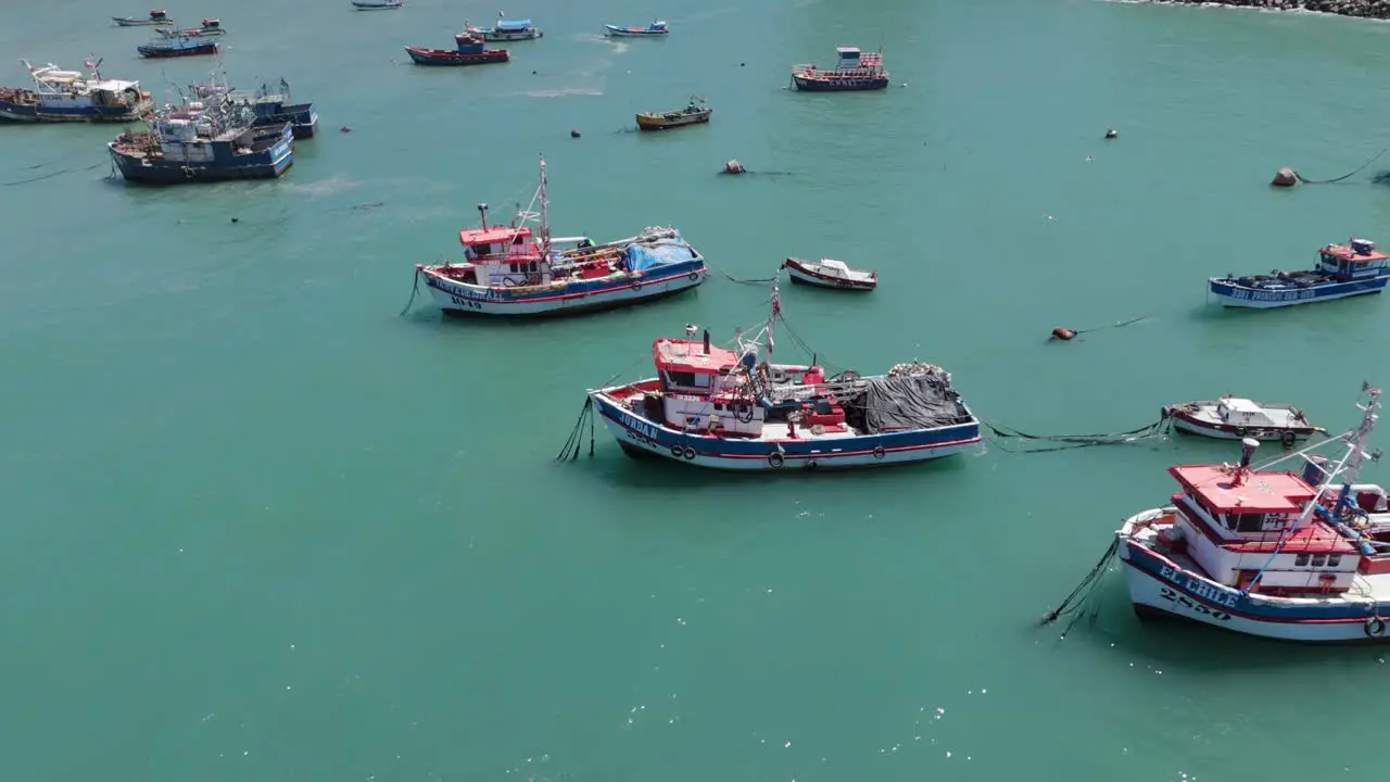 Aerial Flying Over Moored Fishing Boats In Port Of San Antonio In Chile