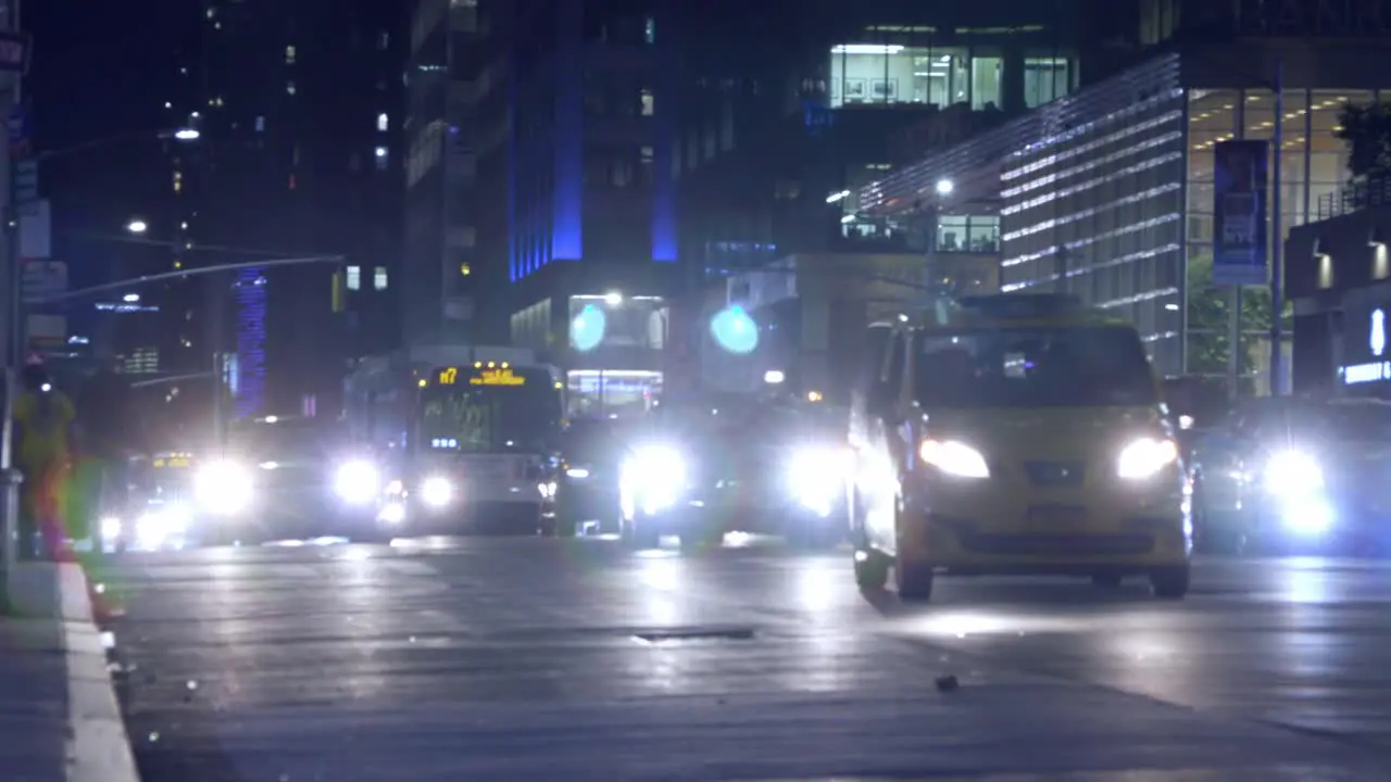 Busy summer night time traffic in New York City street