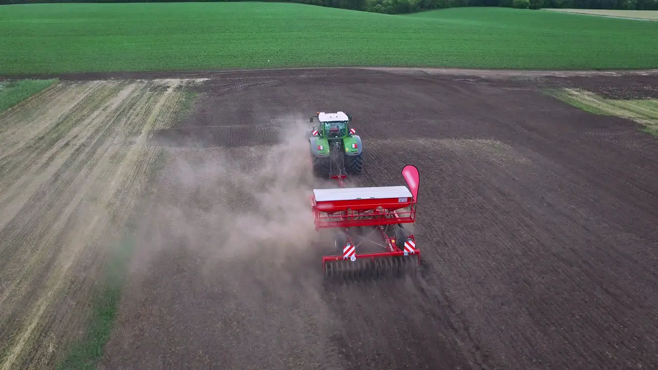 Sowing machine working on plowed field Agricultural machinery