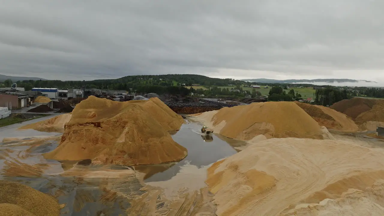 Sawdust mountains at lumber yard in Braskereidfoss Norway