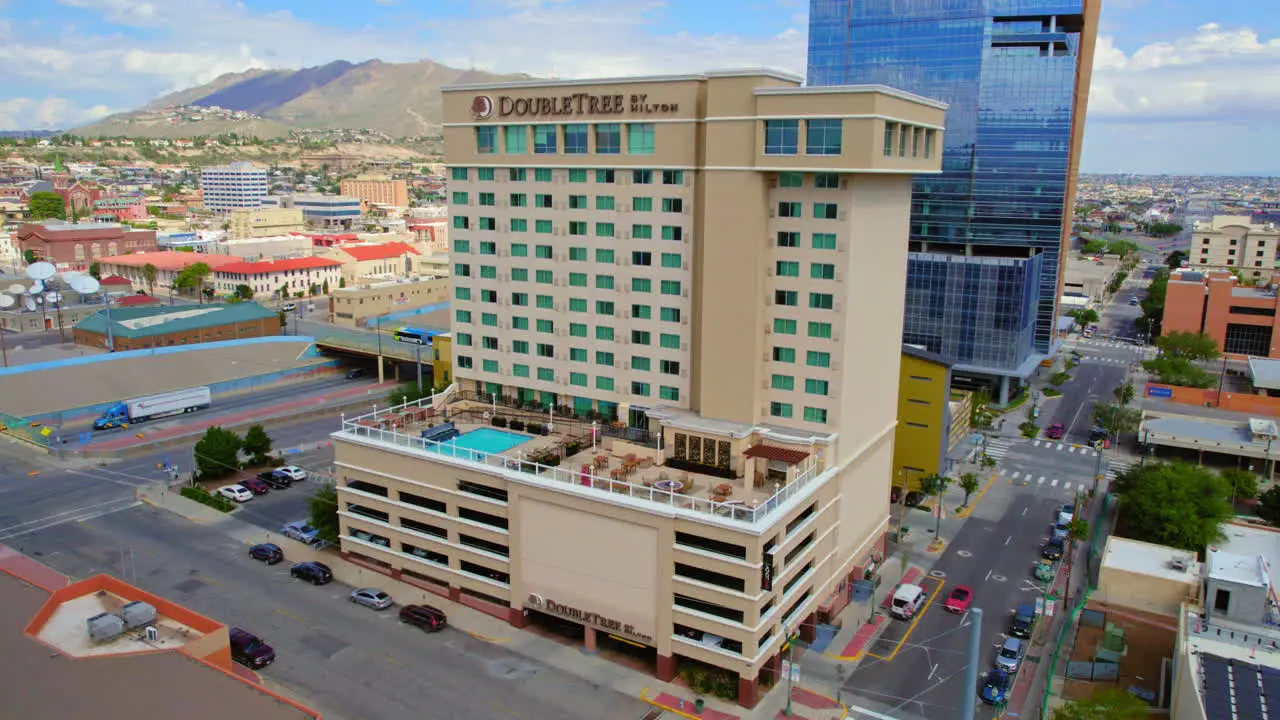 Aerial Drone Establishing Shot of DoubleTree by Hilton Hotel Building in Downtown El Paso TX Area Next to I-10 Freeway