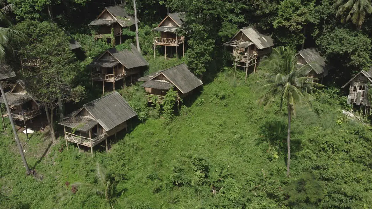 Aerial orbit of empty Tourist Thai bungalows due to pandemic travel restrictions