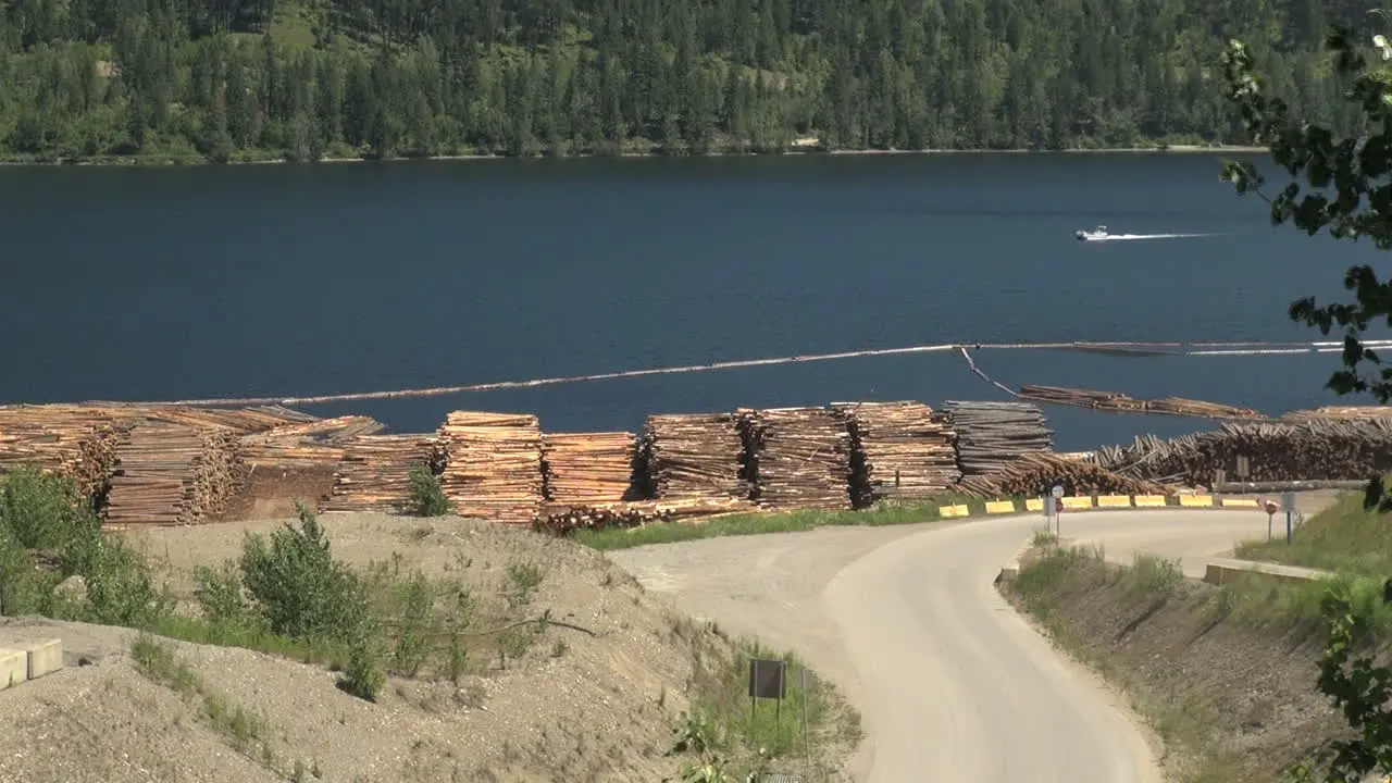 British Columbia Adams Lake logs and boat