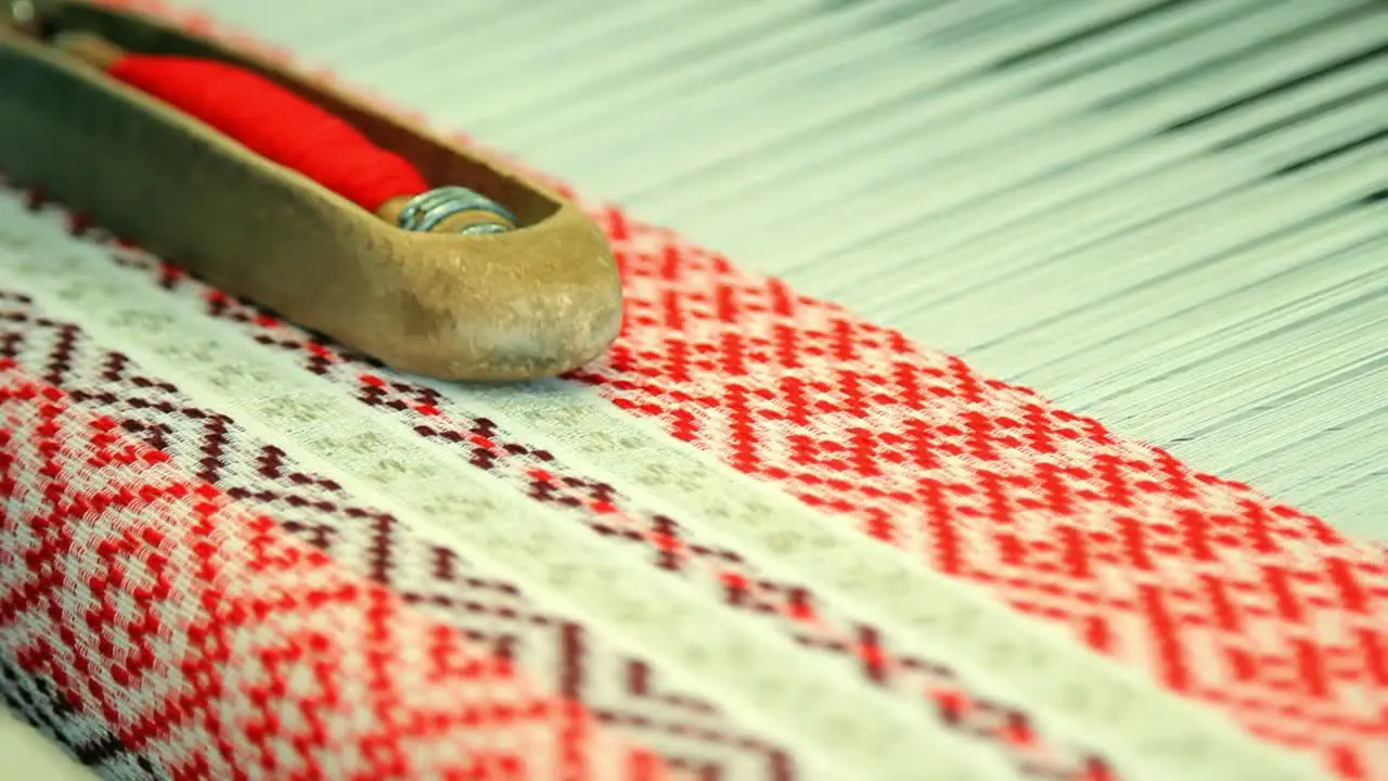 Woman hands working on weaving machine Process of fabric production