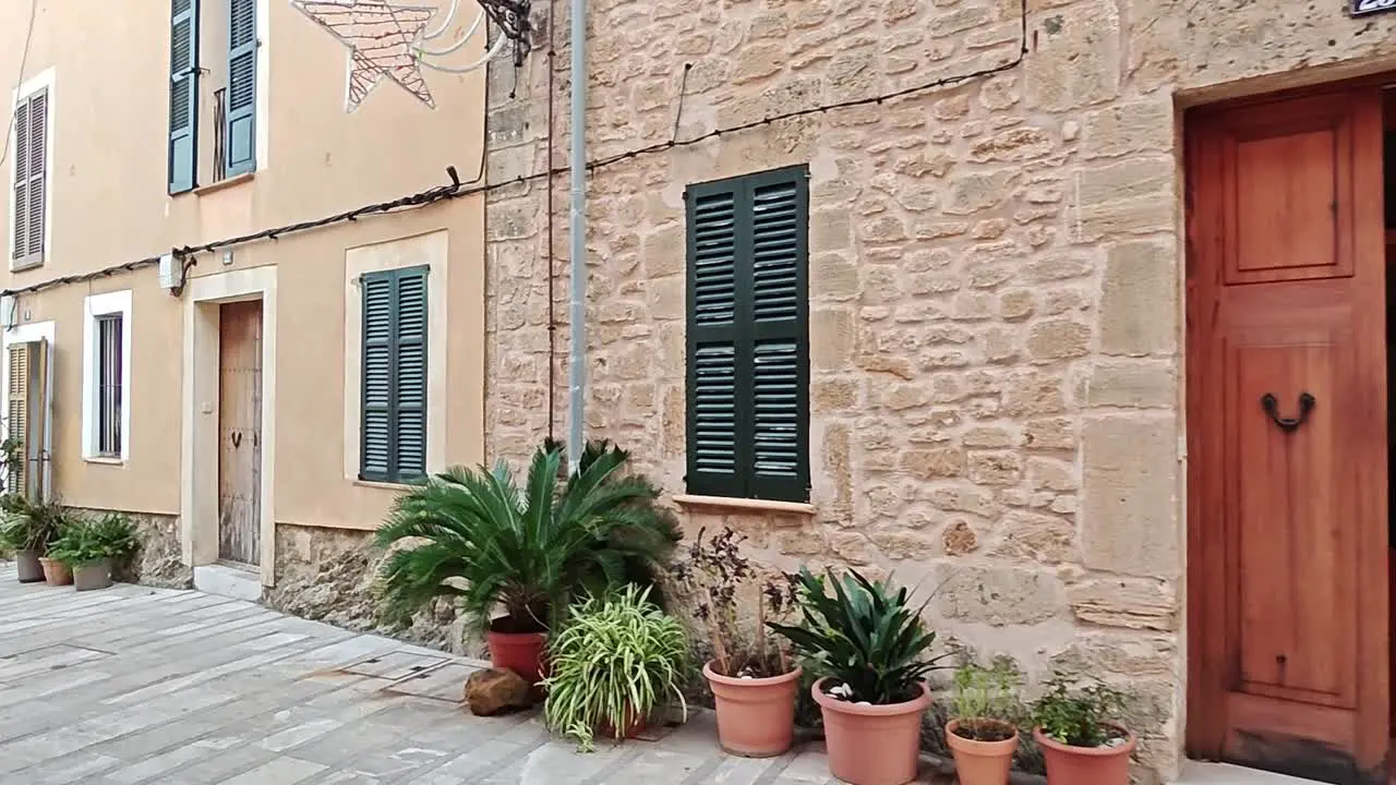 idyllic streets with flower pots in alcudia