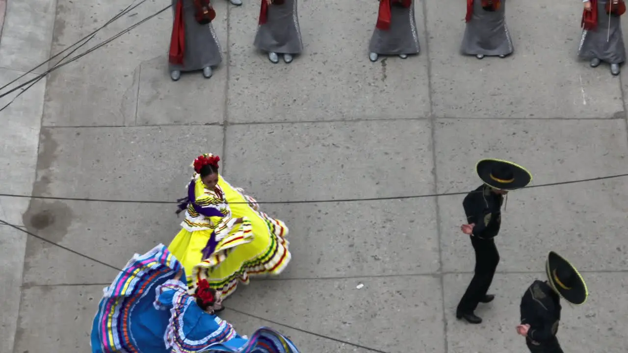 People In Costumes Playing Instruments And Dancing On The Street During Mariachi Festival In Tecalitlan Mexico