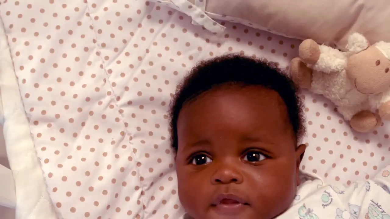 Cute baby lying on the bed 