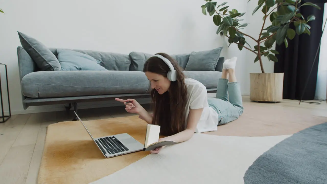 Cute Young Female Makes A Video Call With Her Laptop At Home