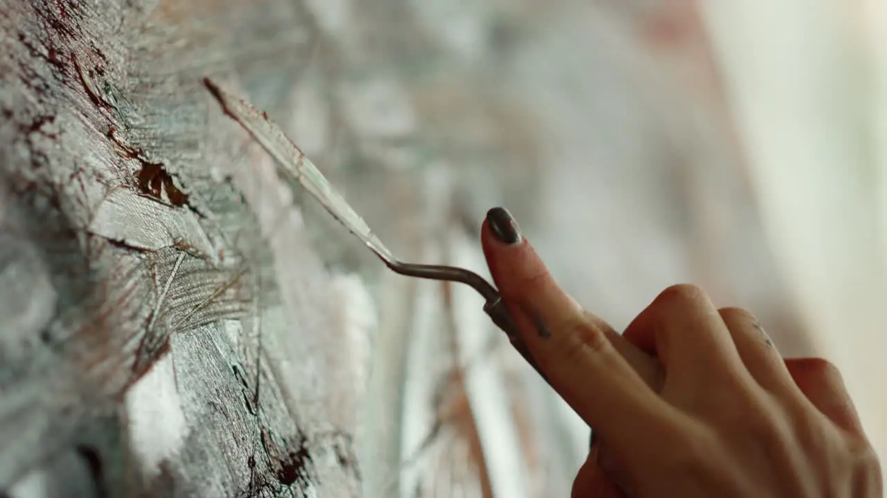 Woman creating artwork in art studio