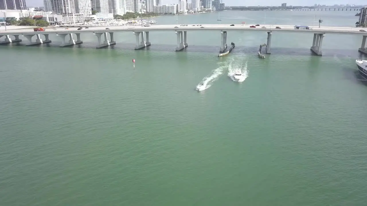 boats traveling through harbor in Miami