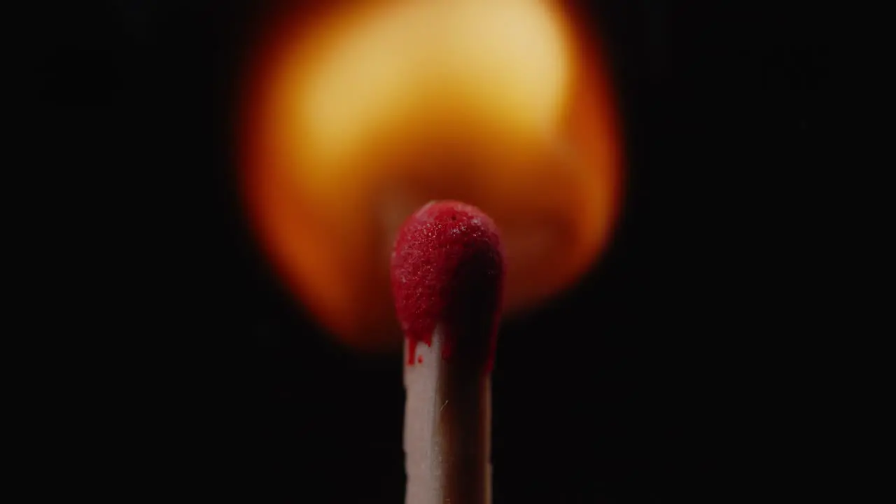 Single Match with Rising Flame Isolated on Black