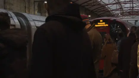 Commuters Waiting on Platform at London Underground Station