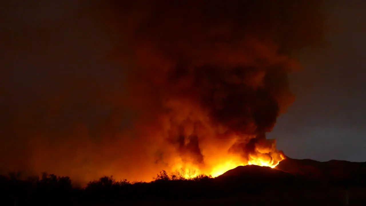 Timelapse of huge fire in the forest after dark the fire blazes and burns quickly at night