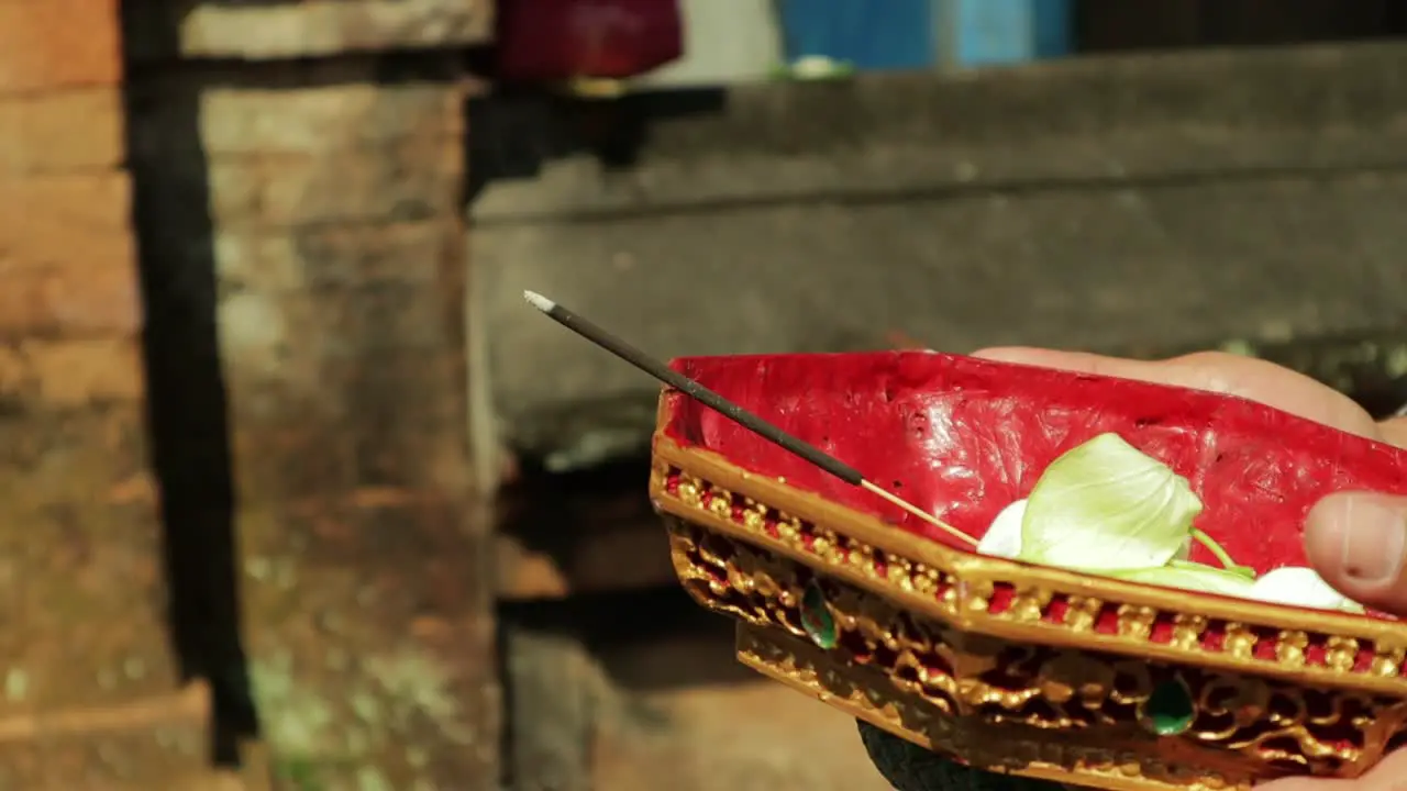 Hindu traditional offering for gods smoke incense on gold plate