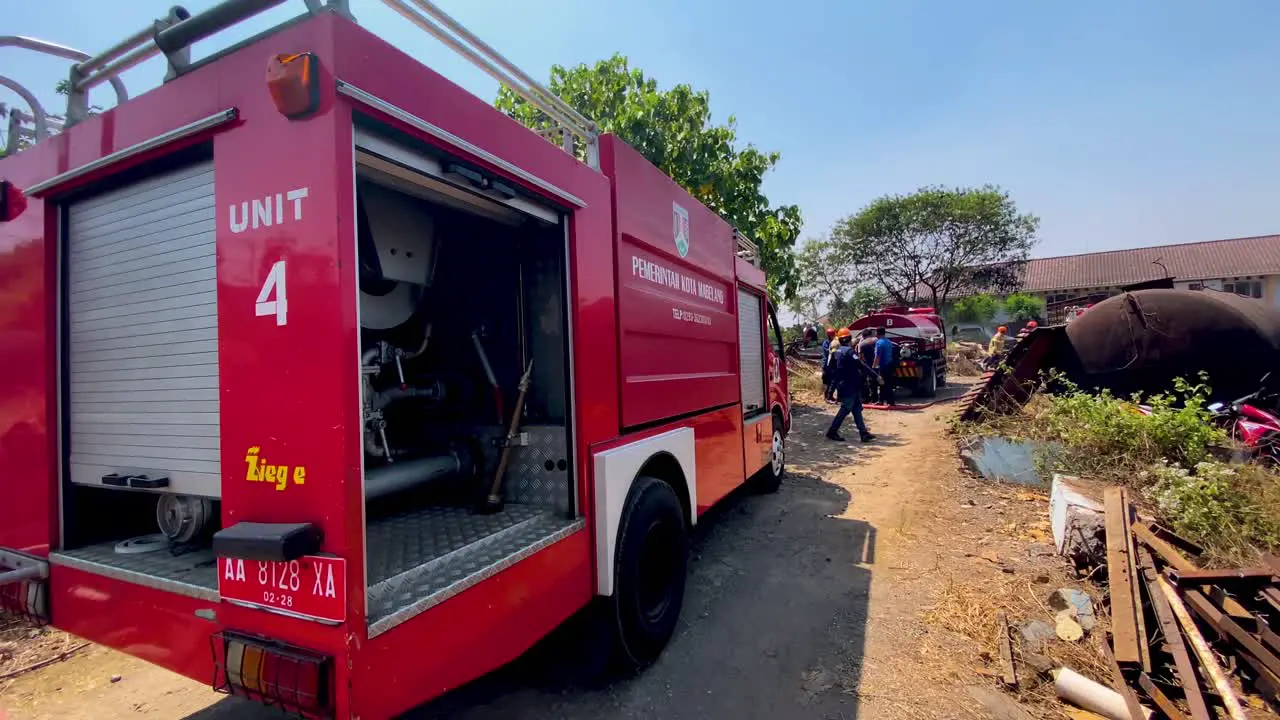 Firefighters reacting to emergency location in Indonesia slow motion view