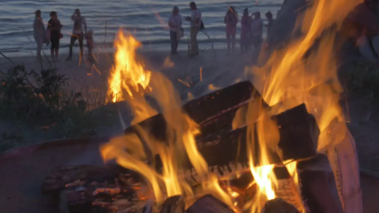 People Watch Burning Bonfires on the Beach of Latvia During Sunset