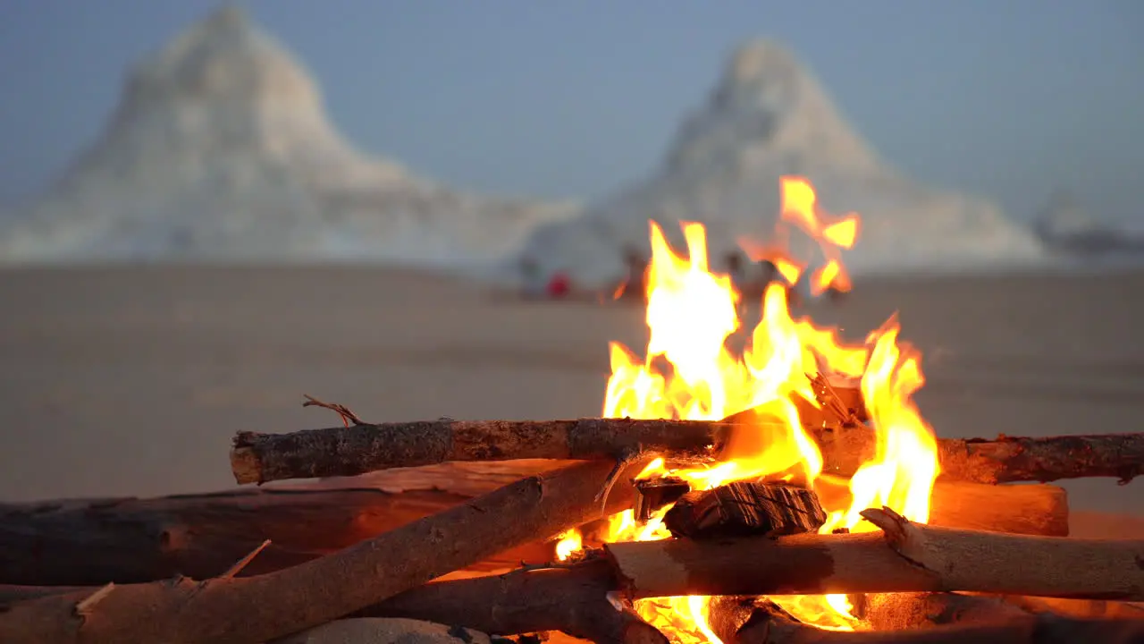 warm bonfire burning fresh wood in the desert during the sunset waiting for night camp during adventour travel tour