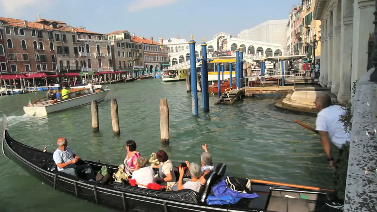 Venice Italy Grand Canal tourists in gondola entering Grand Canal