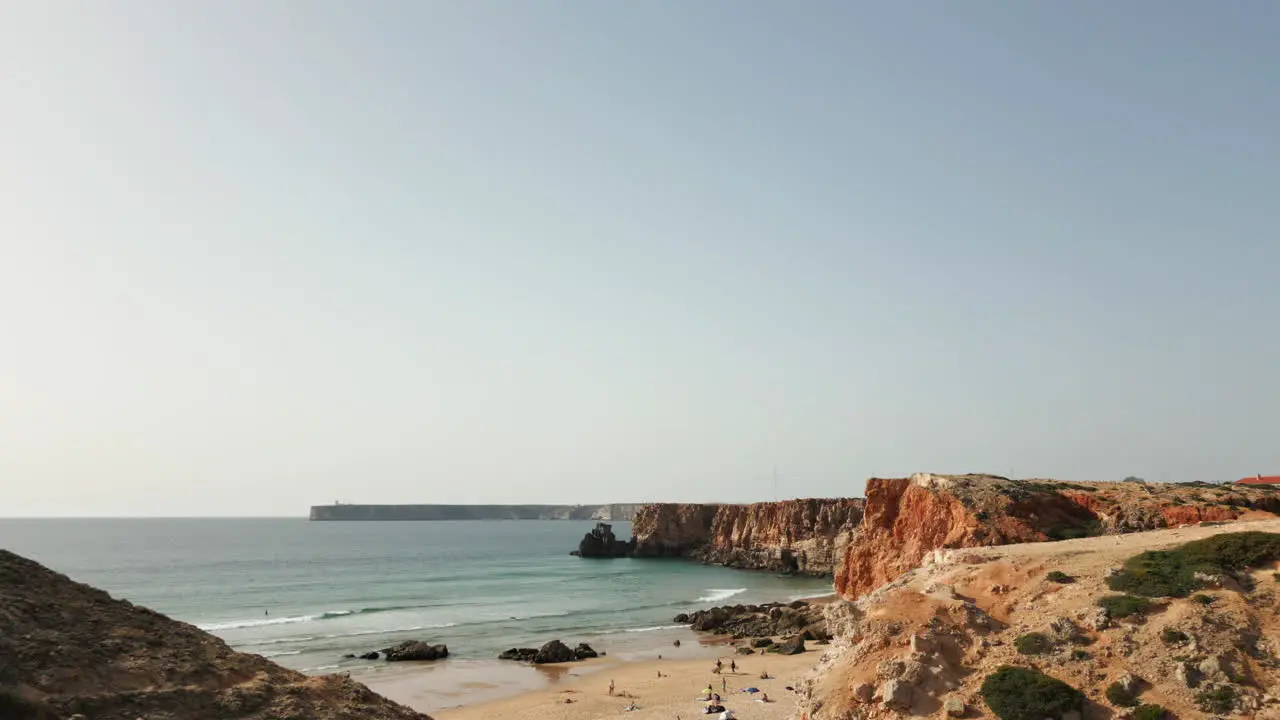 Low flying drone shot away from beach at Sagres Portugal