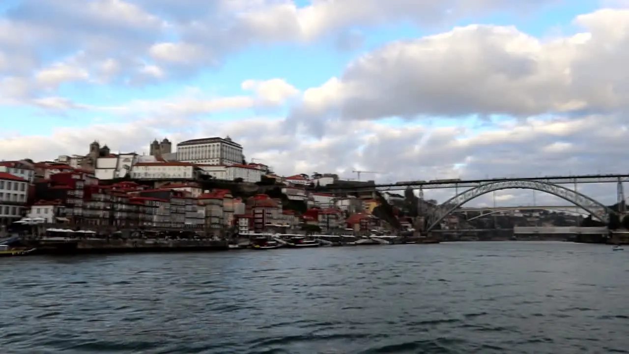 Dom Luis I Bridge seen from Rabelo Boat that navigates Douro River in Porto