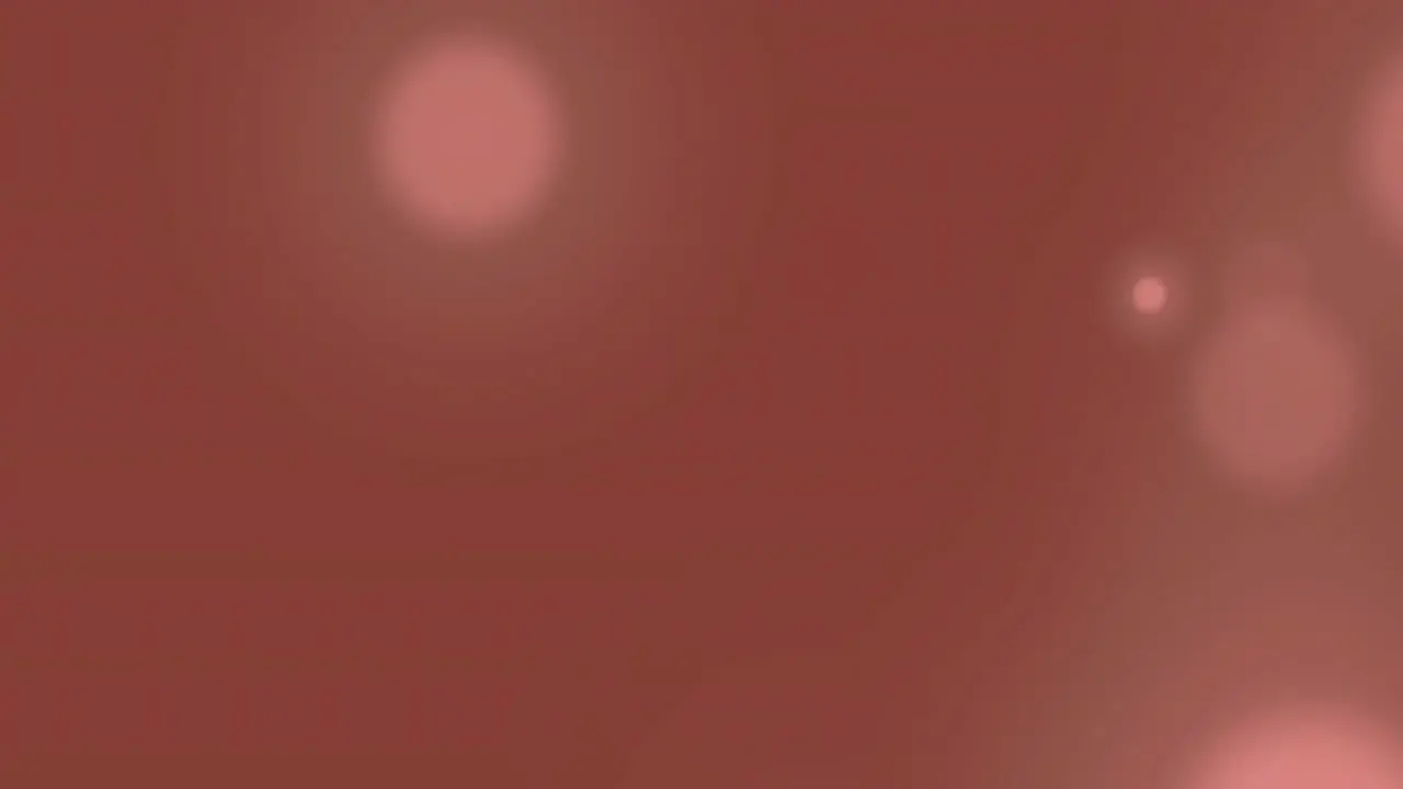 Animation of light spots moving on brown background