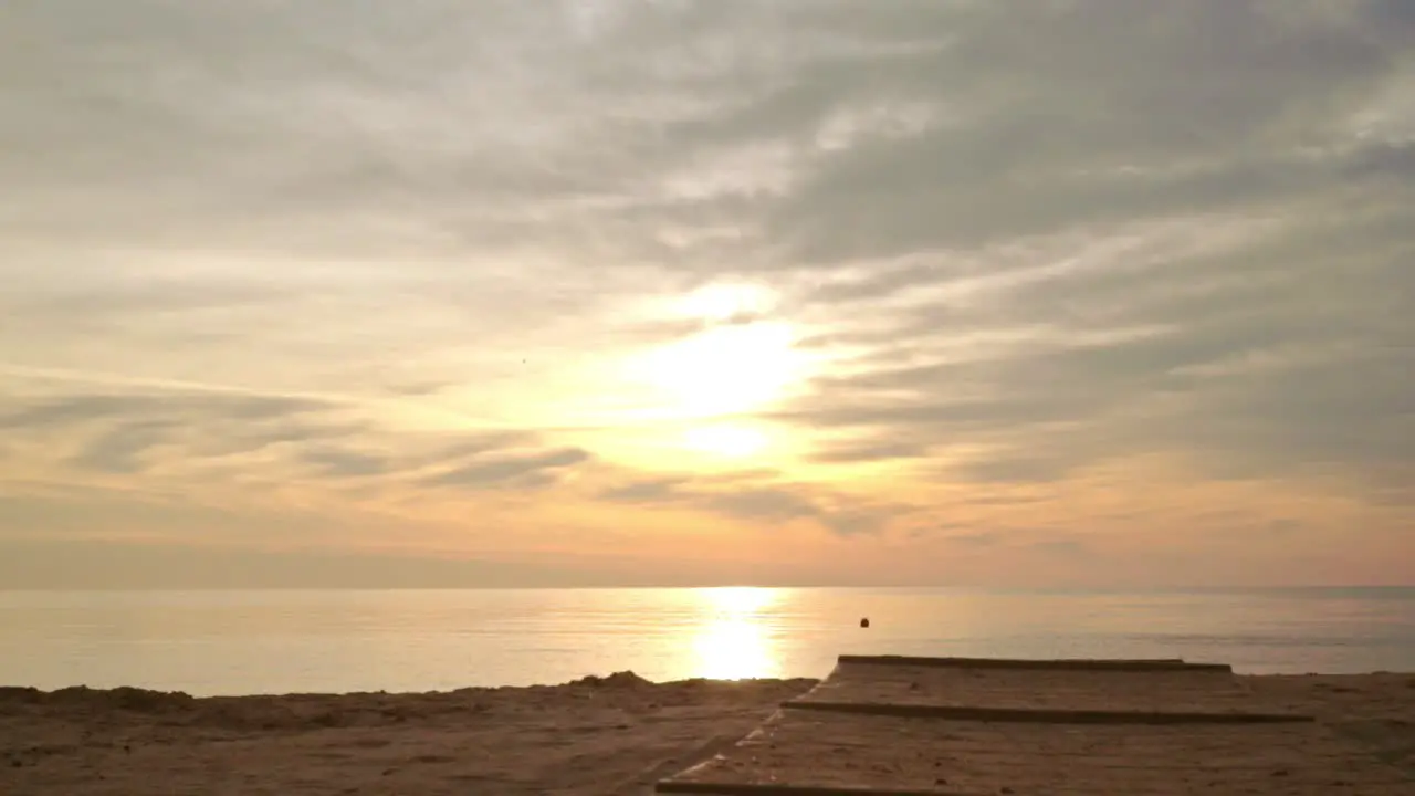 Sunrise beach POV walking on beach First person shot of sea sunrise